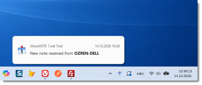 ShixxNOTE notification beside the tray icon announcing a received note, with the sender's name in bold